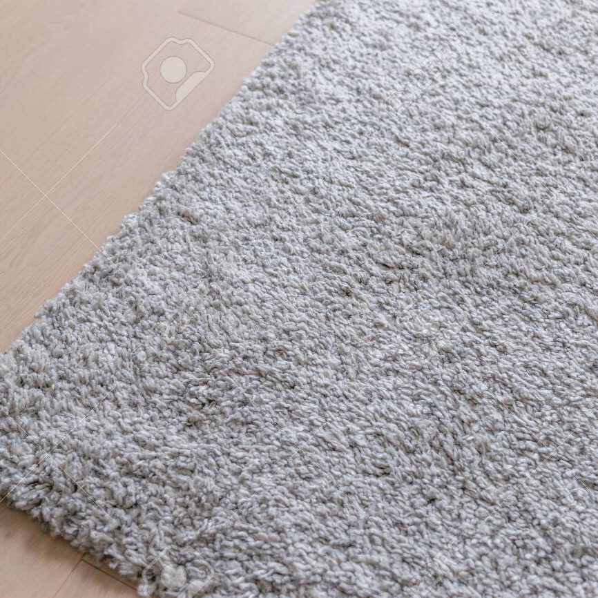 Grey carpet on the wooden floor