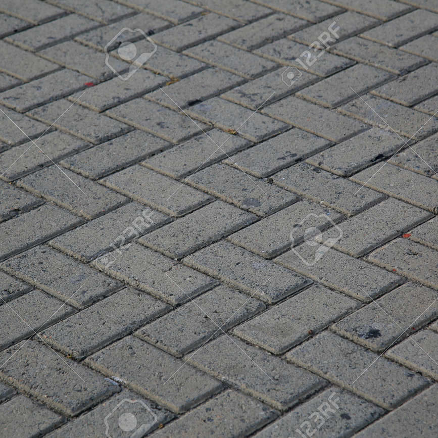 163942468-street-pavement-made-of-concrete-brick-in-the-barra-district-in-the-city-of-salvador-